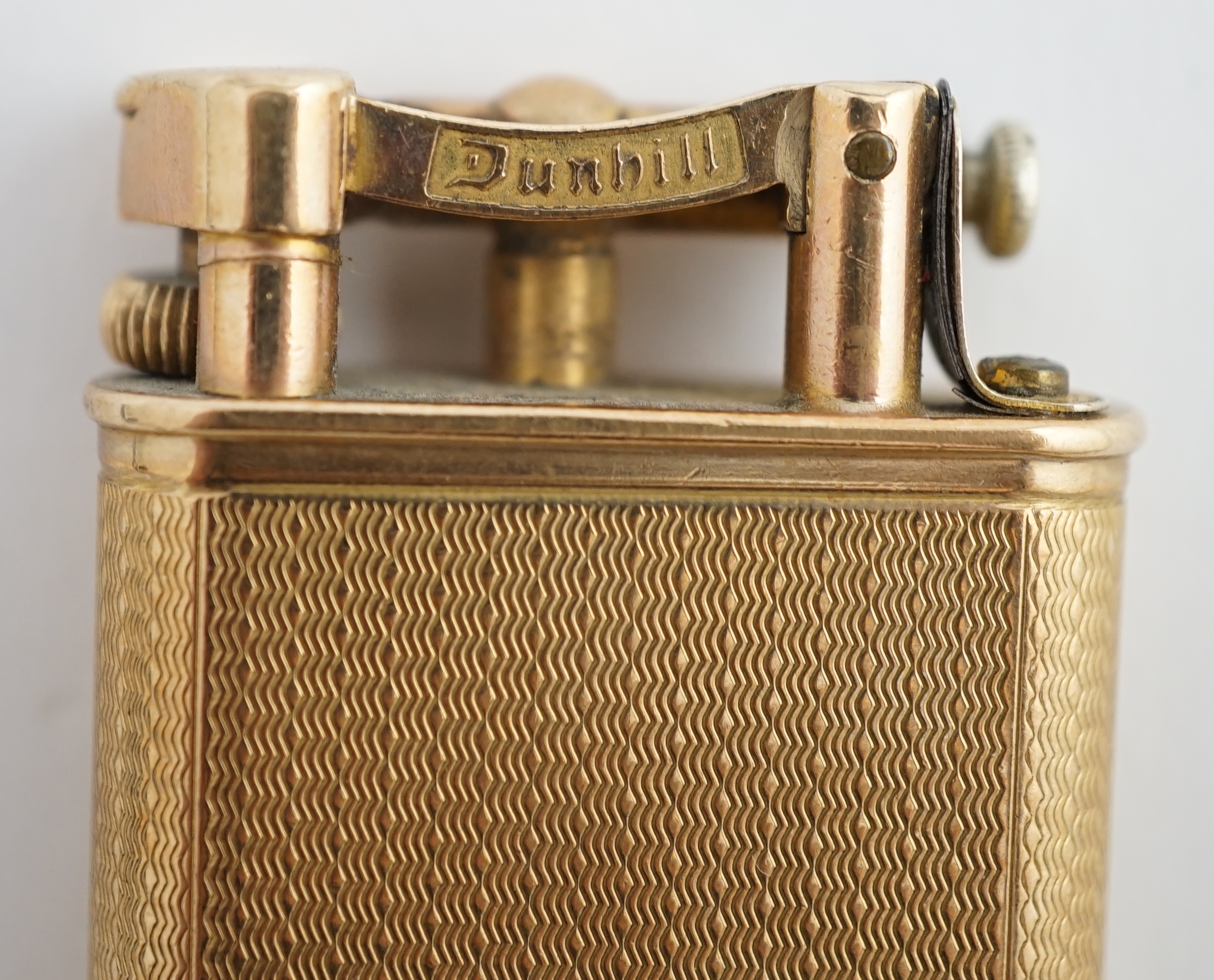 A George V engine turned 9ct gold cased Dunhill lighter